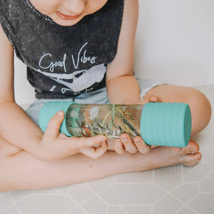 Child holding Calm Down Bottle