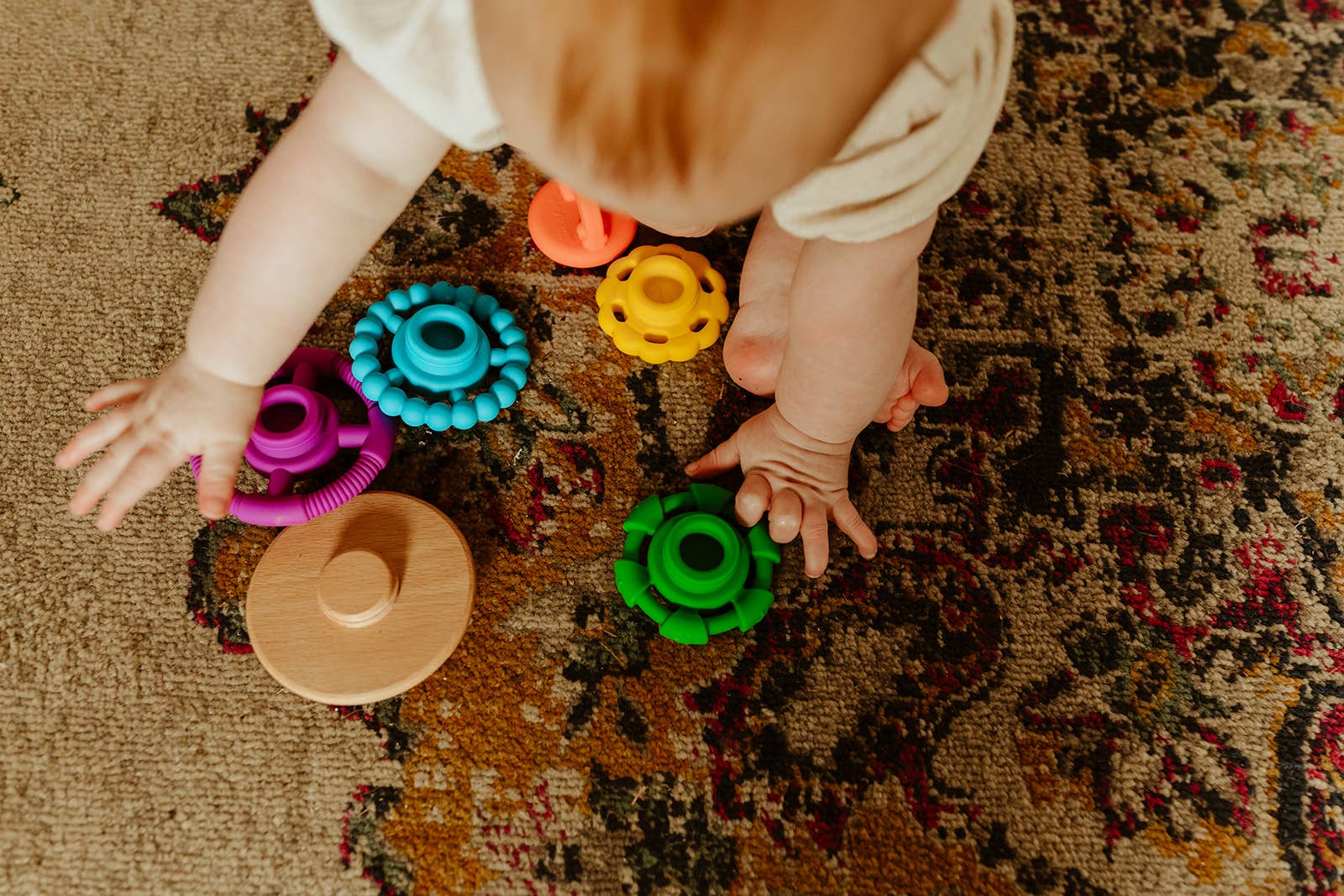 Child playing with Jellystone Designs - Wobble Stacker