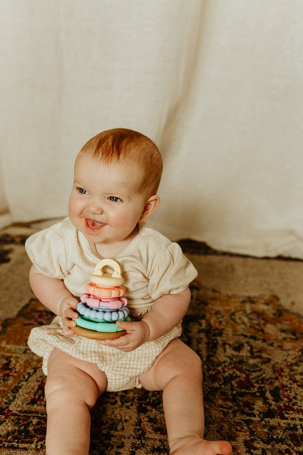 Child playing with Jellystone Designs - Wobble Stacker