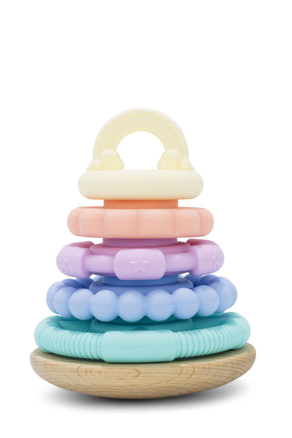 A colorful stacking toy made of beech wood with a series of round rings in pastel colors, stacked on top of each other with a wooden base.