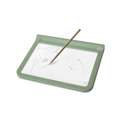 Green drawing board with a white sheet of paper and a wooden stylus on a white background