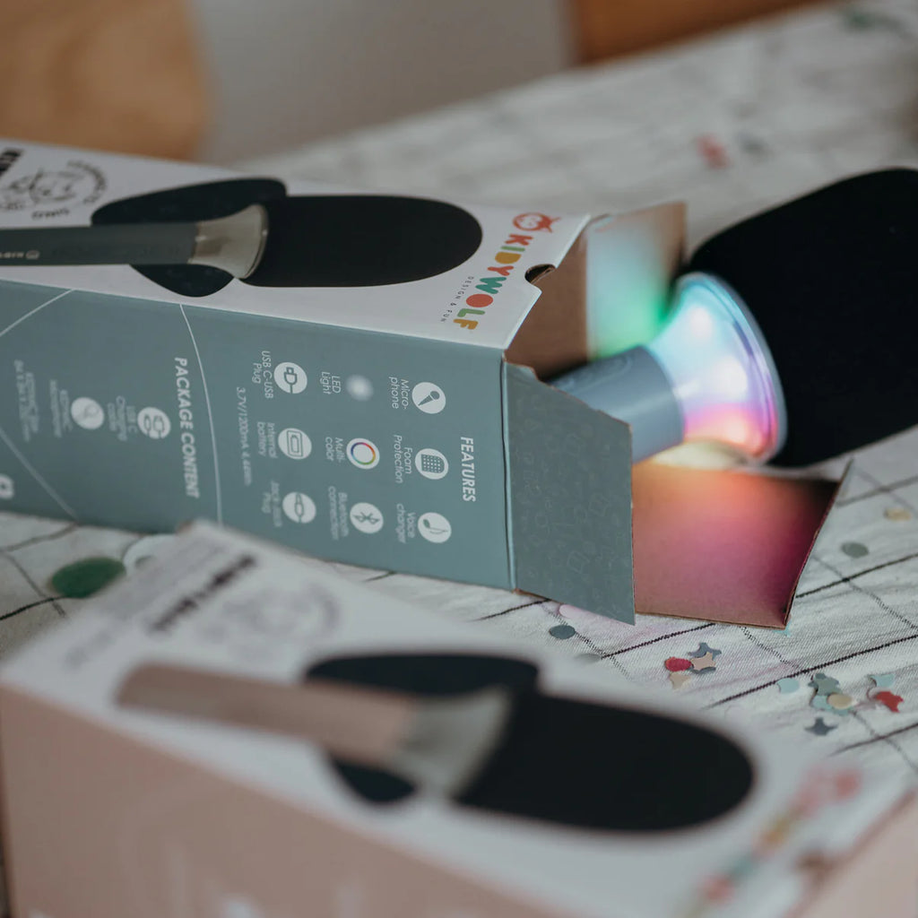 Colorful LED light-up mic with packaging on a patterned surface