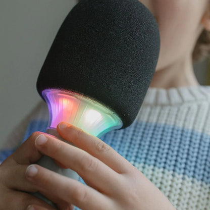Black microphone with colorful LED light held by a person