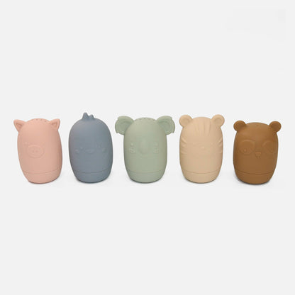 A set of five silicone bath toys in various colors, each shaped like an animal face, displayed in a row.