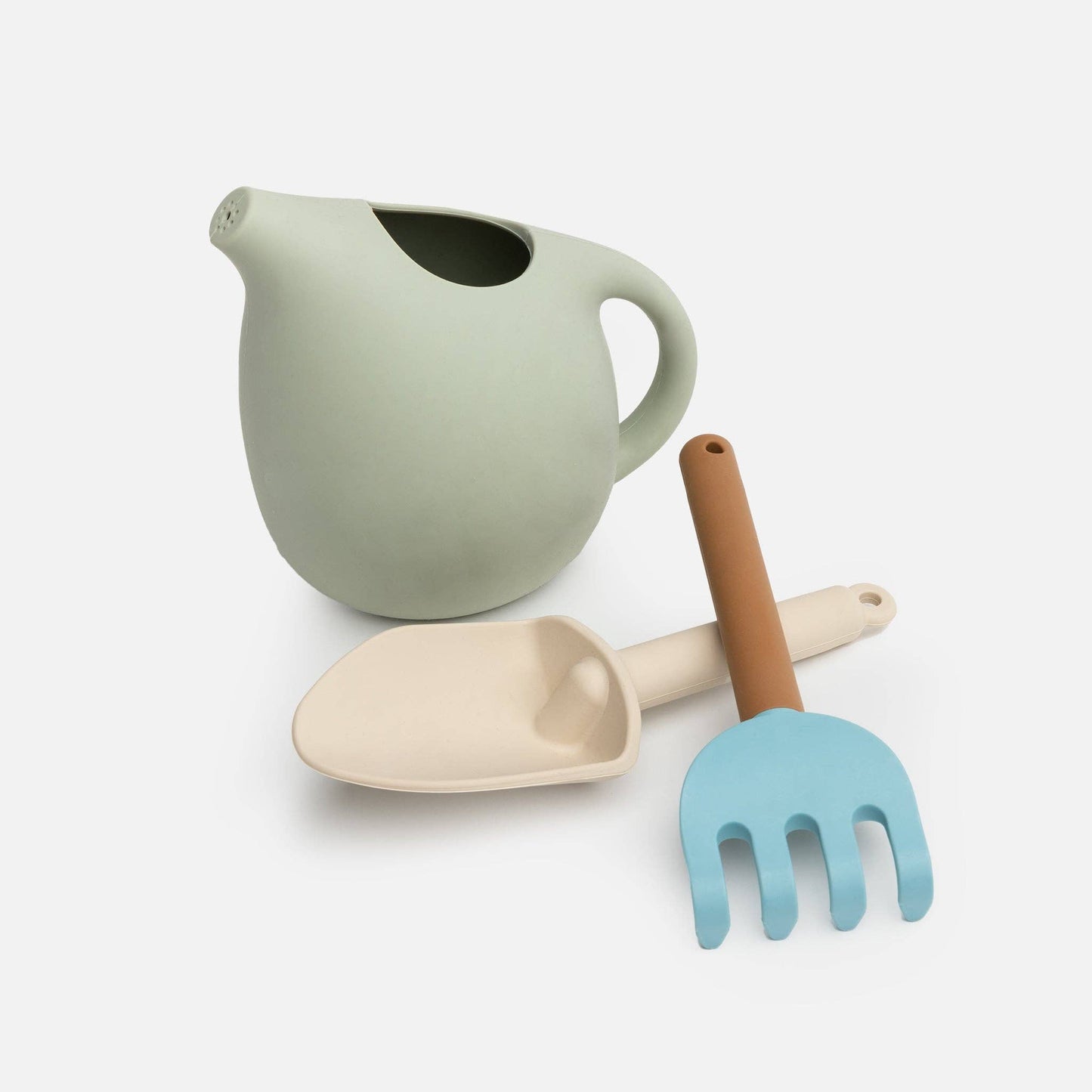 A set of silicone gardening tools including a watering can, a fork, and a trowel, in soft pastel colors.