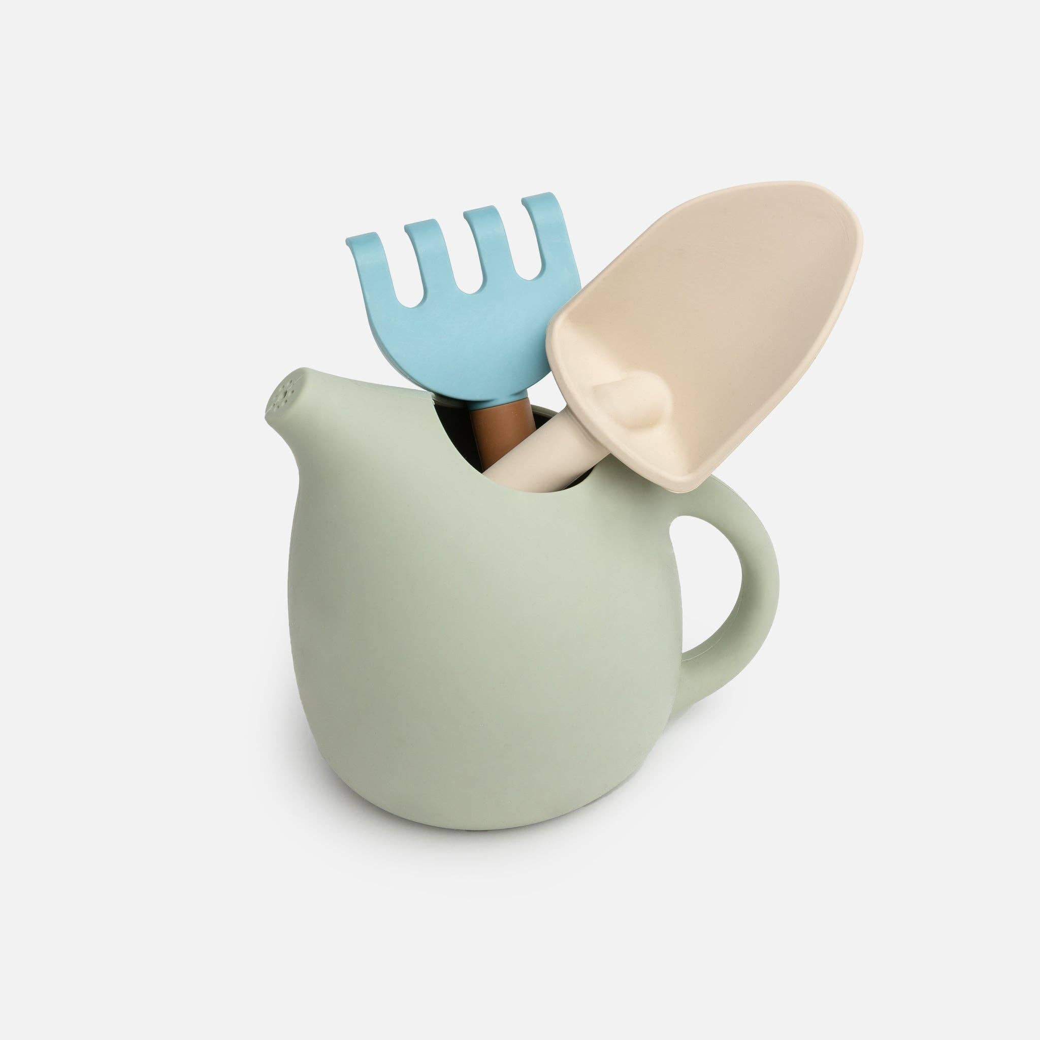 A set of silicone gardening tools including a watering can, a fork, and a trowel, in soft pastel colors.