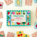 Fruit and veg memory matching game box surrounded by colorful game cards on a light background