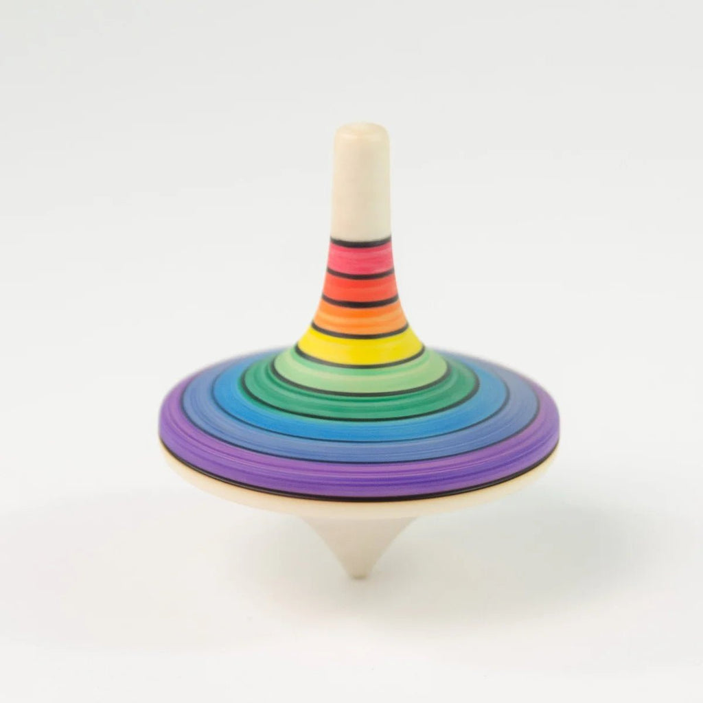 Colorful wooden spinning top on a white background