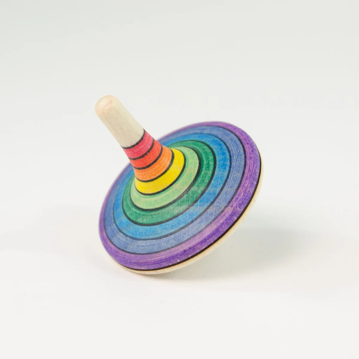 Colorful wooden spinning top on a white background