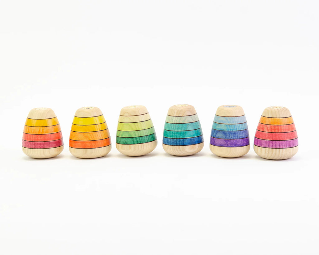 Set of six rainbow-colored wooden toys stacked vertically on a white background