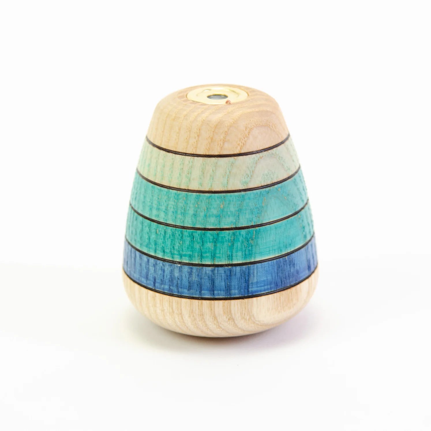 Wooden toy with striped blue and green design on a white background