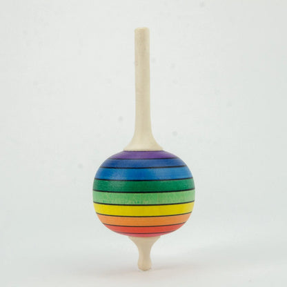 Colorful striped wooden top on a white background
