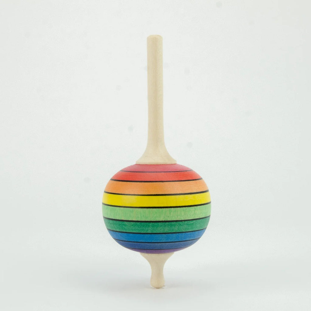 Colorful wooden top on a white background