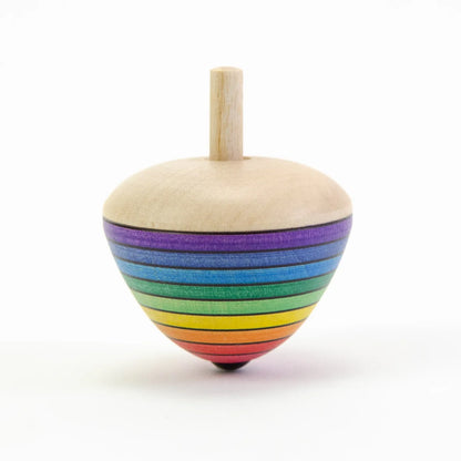 Colorful wooden top with rainbow stripes on a white background