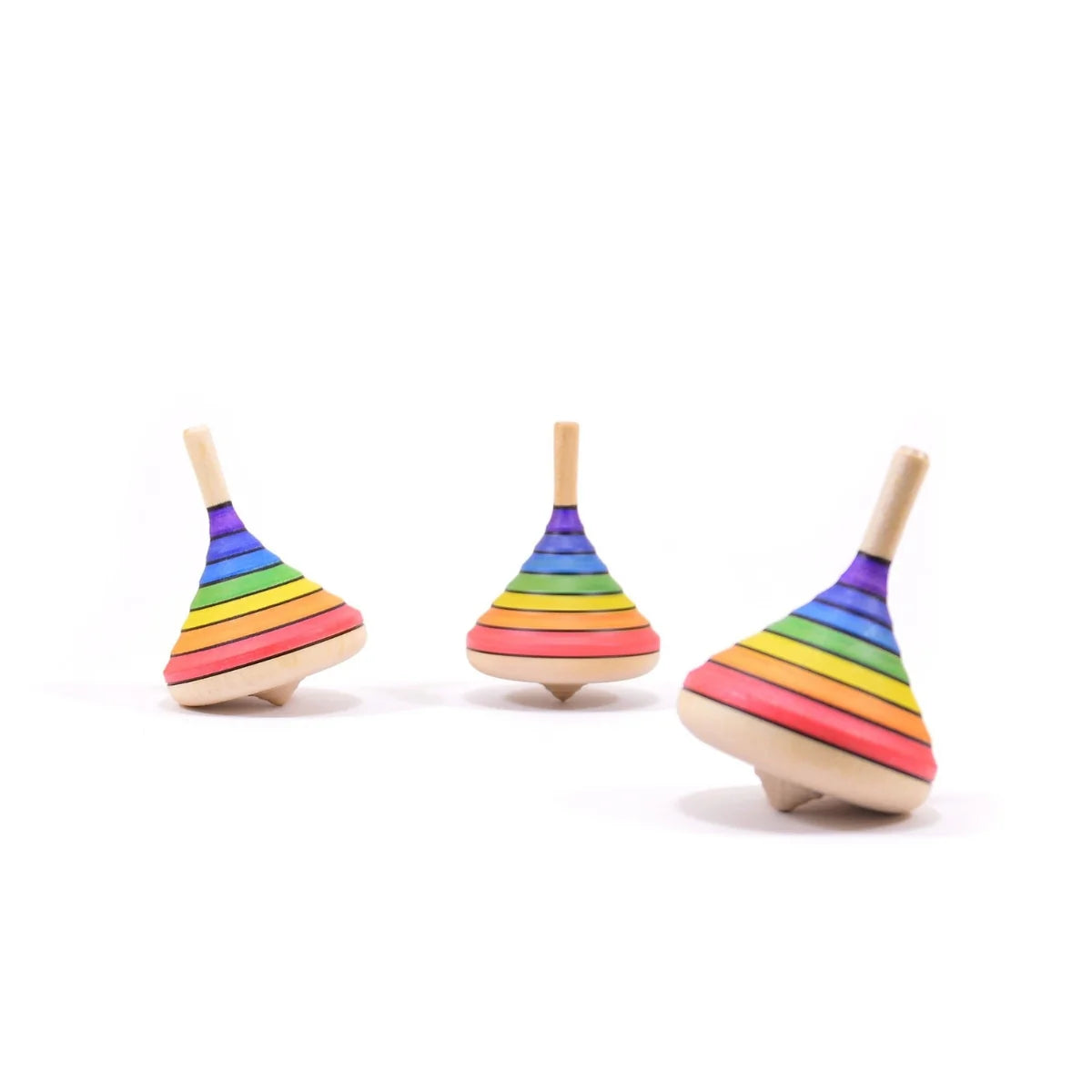 Three rainbow-striped wooden spin tops on a white background