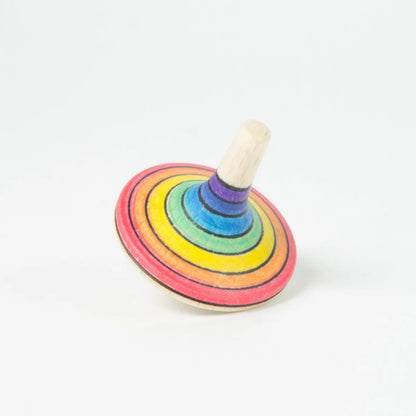 Colorful wooden spinning top on a white background