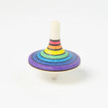 Colorful wooden spinning top on a white background