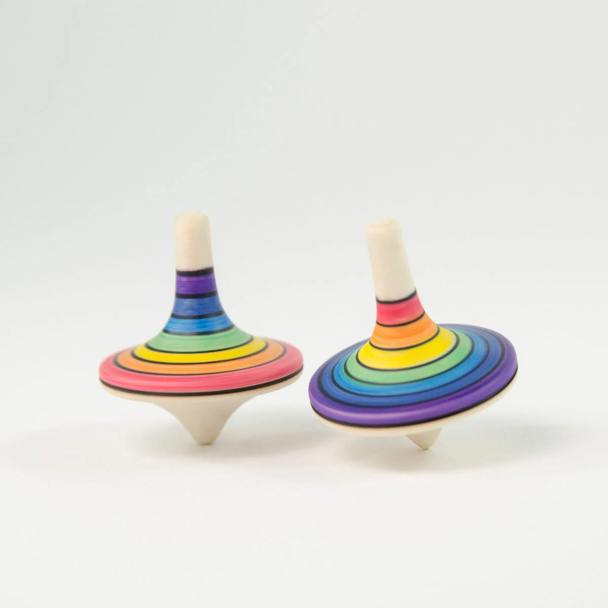 Two rainbow-colored spindles on a white background