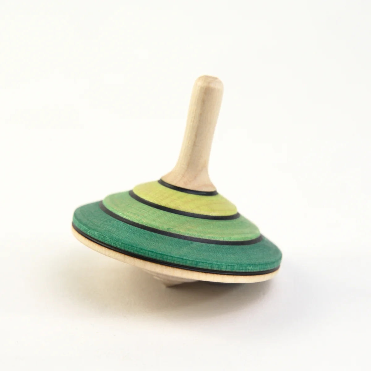 Wooden spinning top with green and beige design on a white background