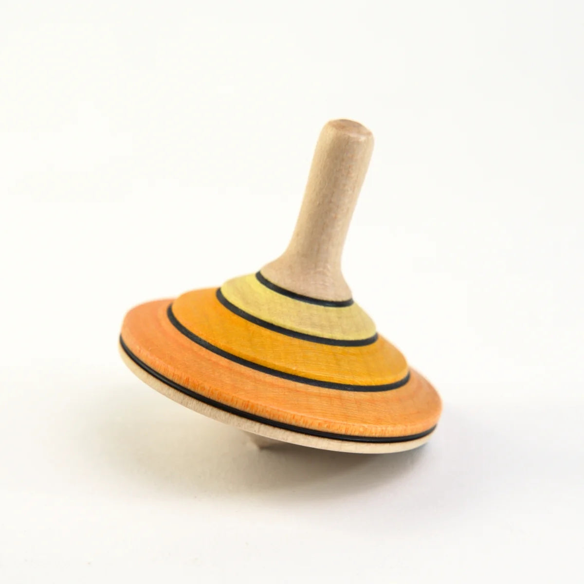 Wooden spinning top with multicolored rings on a white background