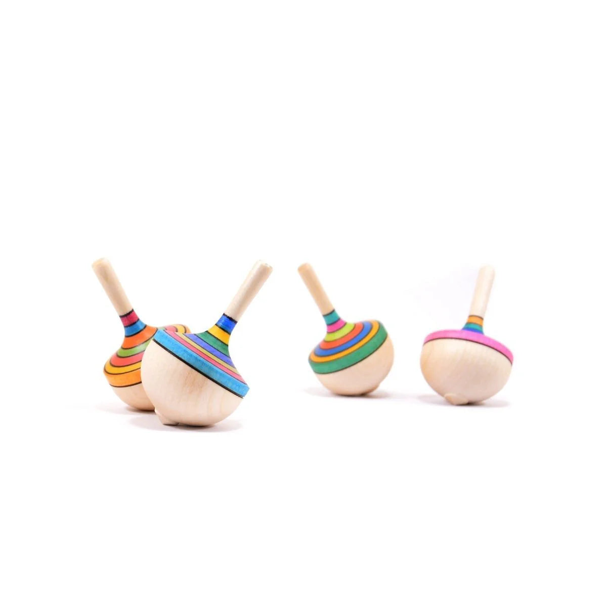 Colorful wooden top toys on a white background