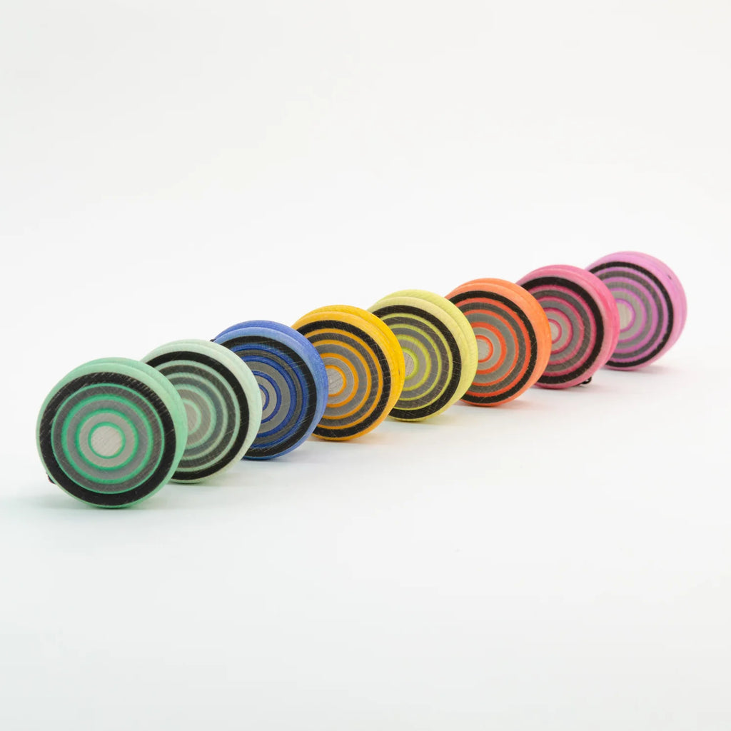 Row of colorful yoyo's on a white background