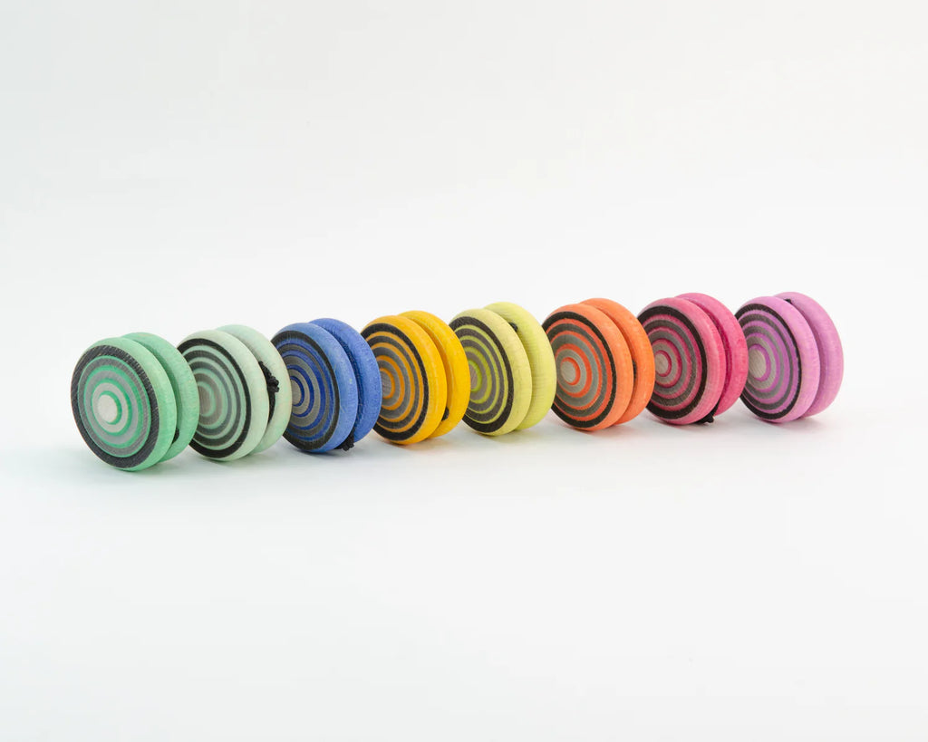 Row of colorful spiral-patterned objects on a white background