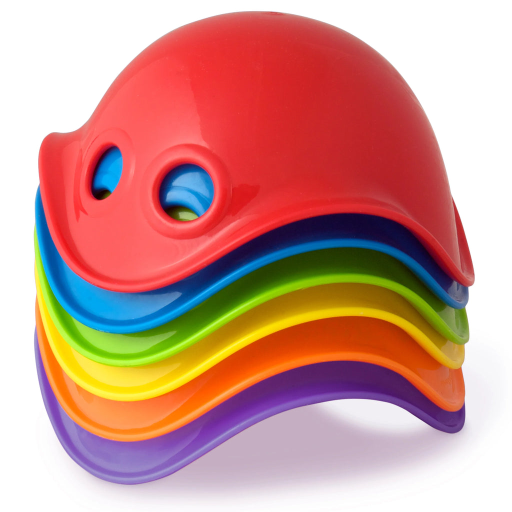 Colorful toy with a red top and stacked rainbow layers on a white background