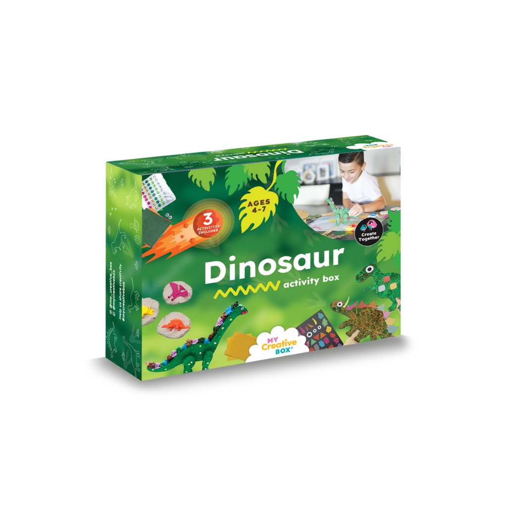 A green box packaging for a Dinosaur Mini Creative Kit with images of children engaging in craft activities and the contents of the kit such as clay, paint, and a wooden dinosaur model.