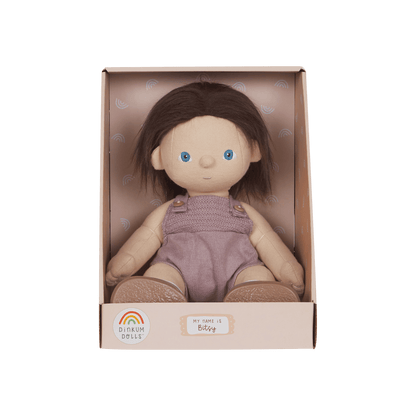 Dinkum Dolls doll in a pink box on a green background