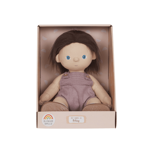 Dinkum Dolls doll in a pink box on a green background