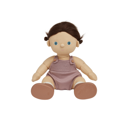 Toy doll with a pink romper on a white background