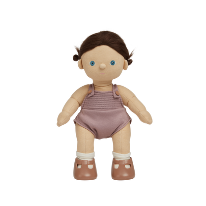 Doll with a purple outfit on a white background