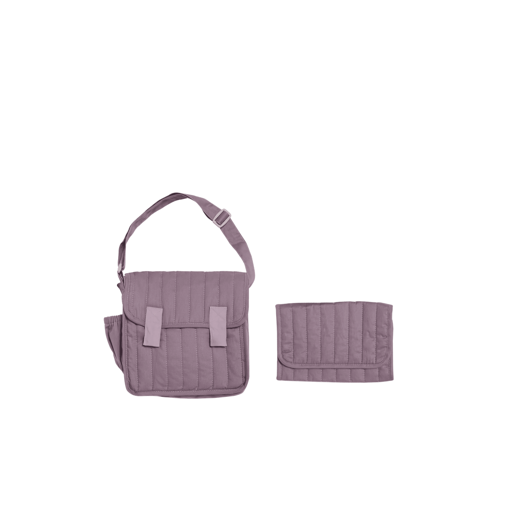 Purple quilted diaper bag with matching wallet on a white background