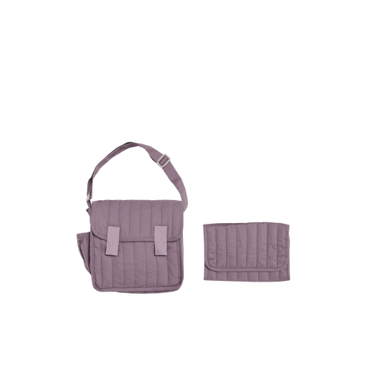 Purple quilted diaper bag with matching wallet on a white background
