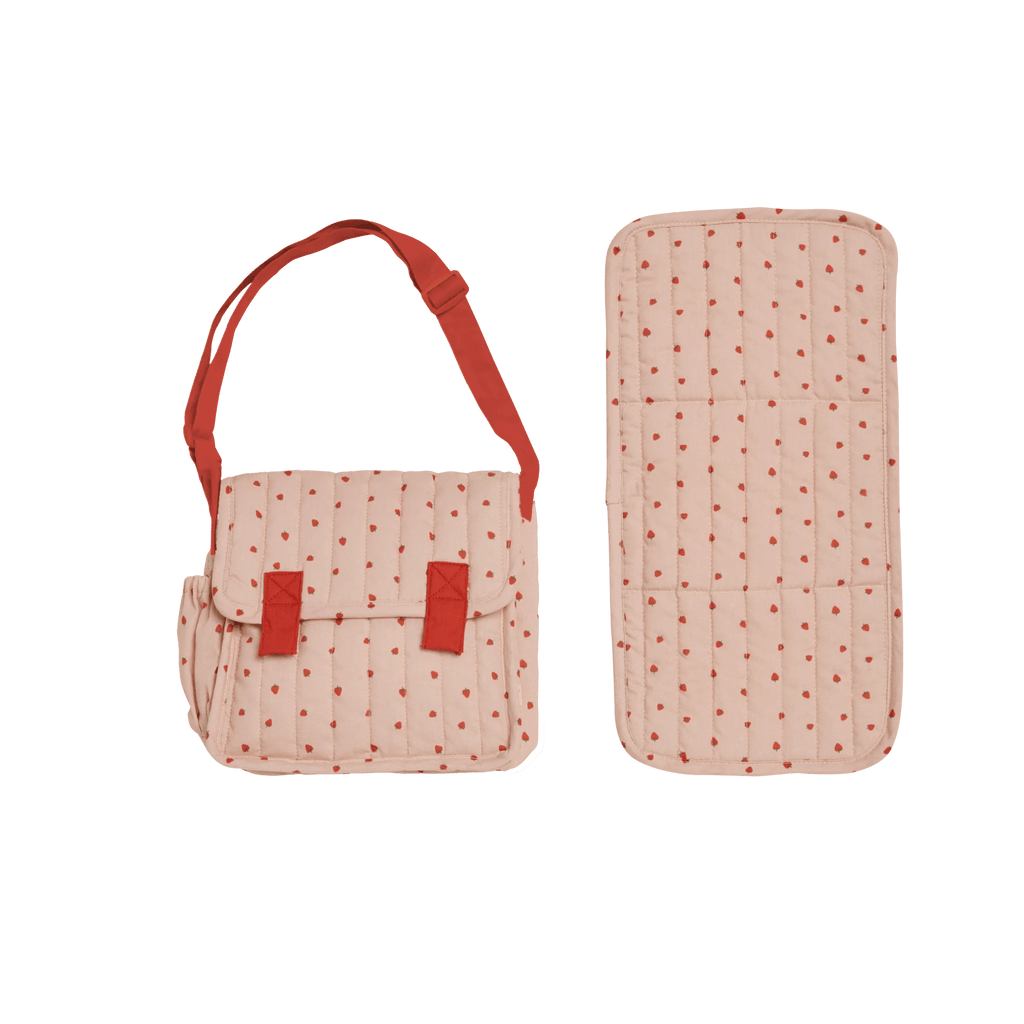 Pink polka dot bag with red straps and matching rectangular item on a white background