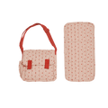 Pink polka dot bag with red straps and matching rectangular item on a white background