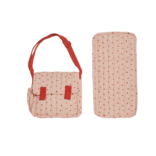Pink polka dot bag with red straps and matching rectangular item on a white background