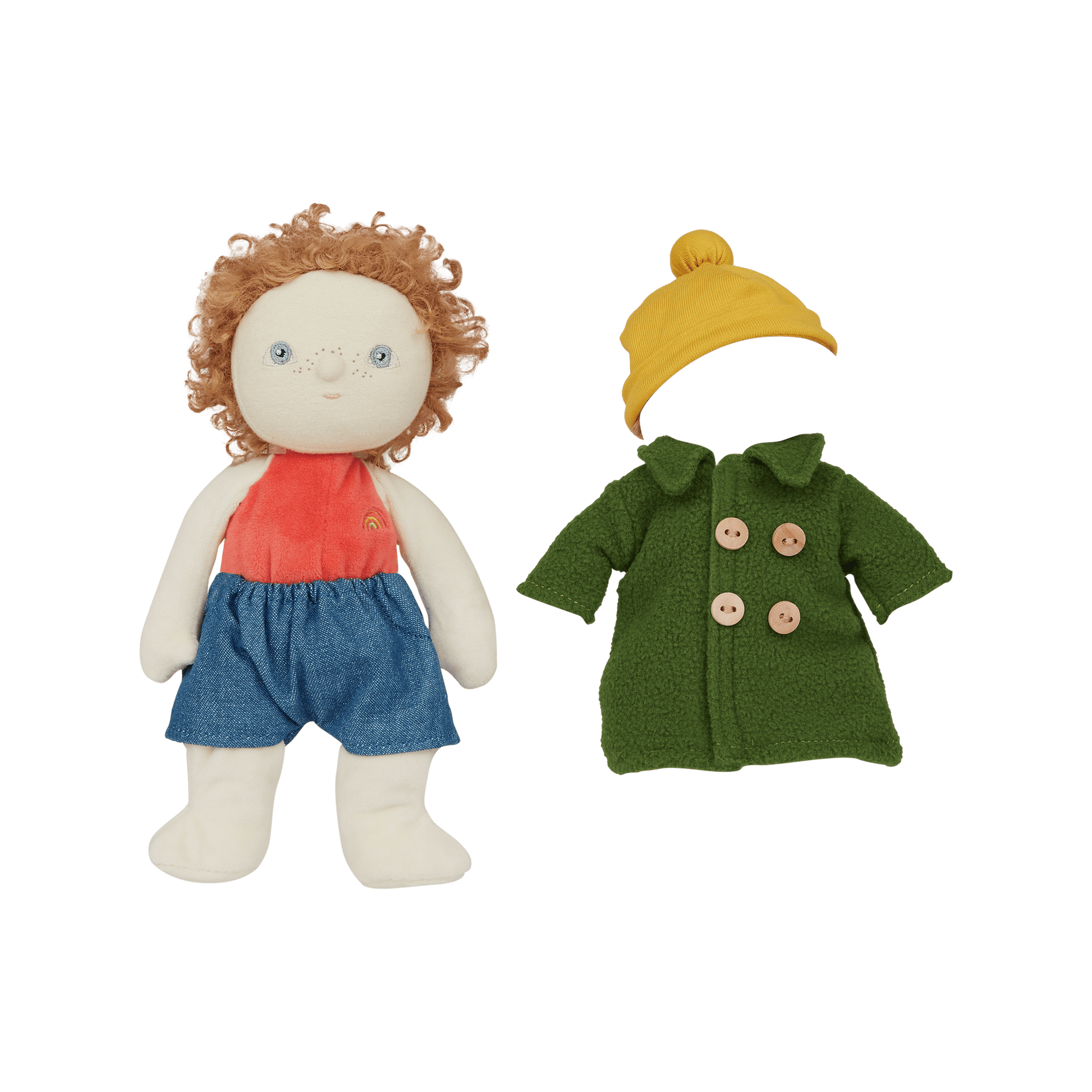 Stuffed doll with red shirt, blue shorts, and yellow hat next to a green coat on a transparent background