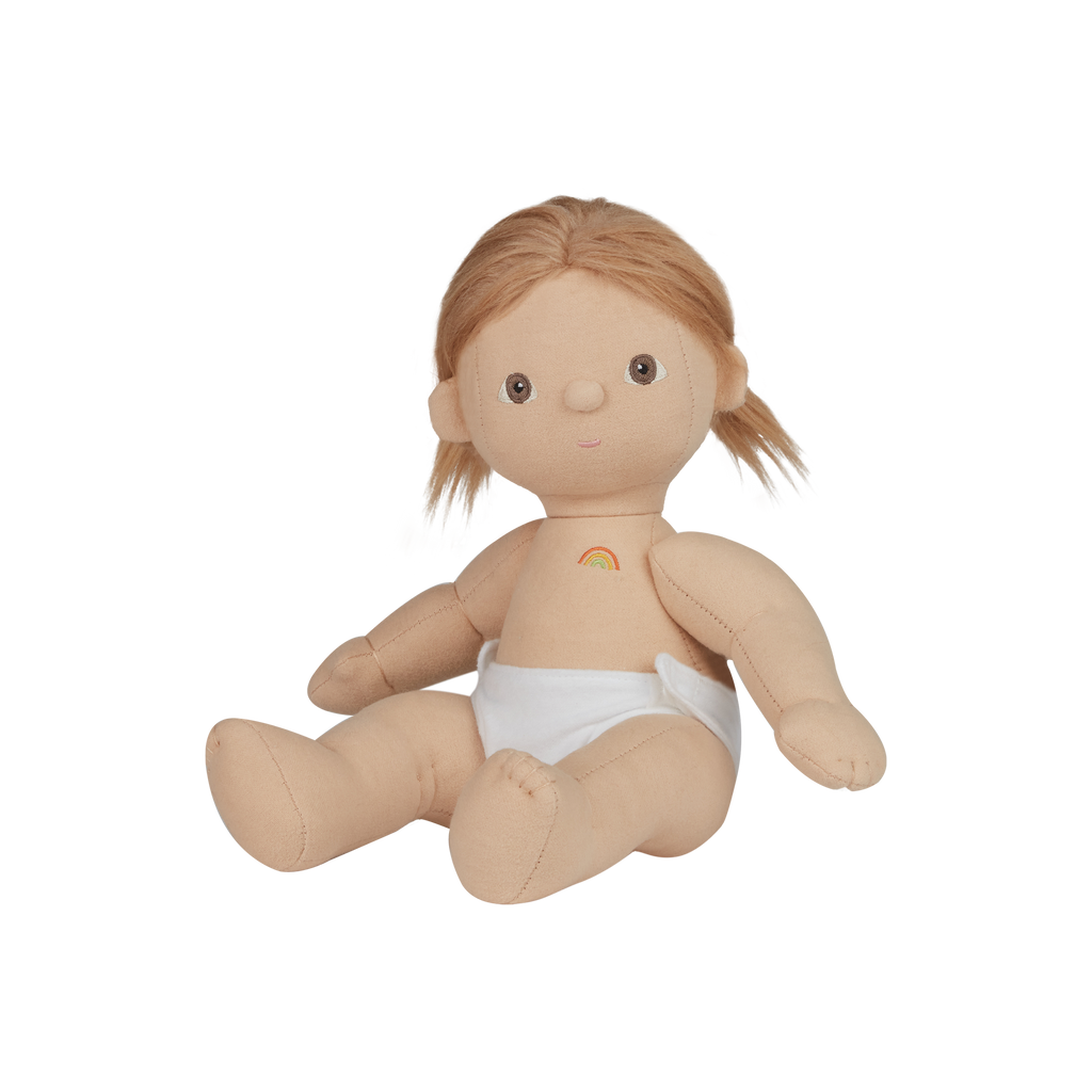 Plush doll with blonde hair and a rainbow on a white background