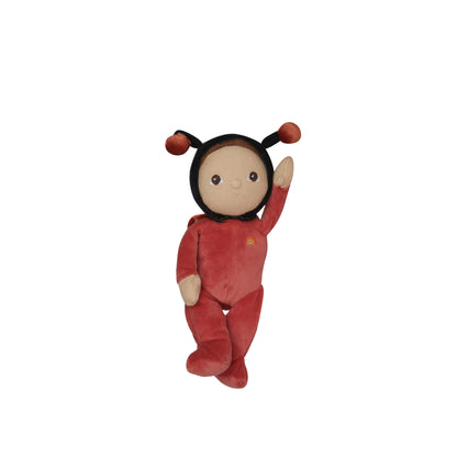 Plush toy in a red outfit with black hair on a white background