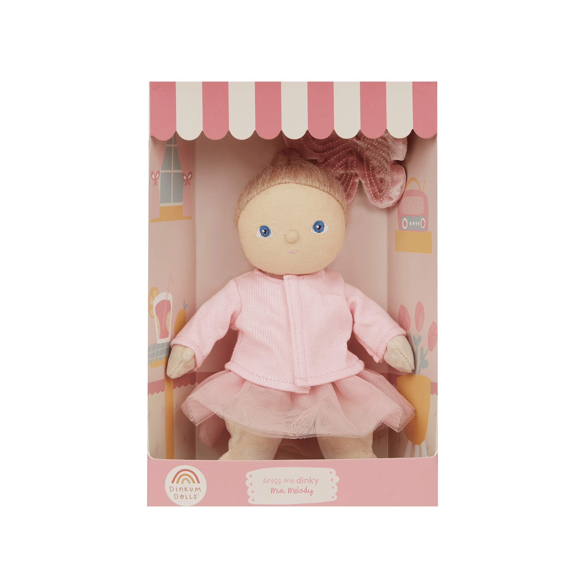 Doll in a pink outfit with a matching box on a green background