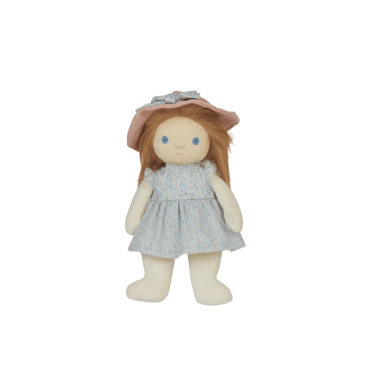 Stuffed doll with a pink hat and light blue dress on a white background