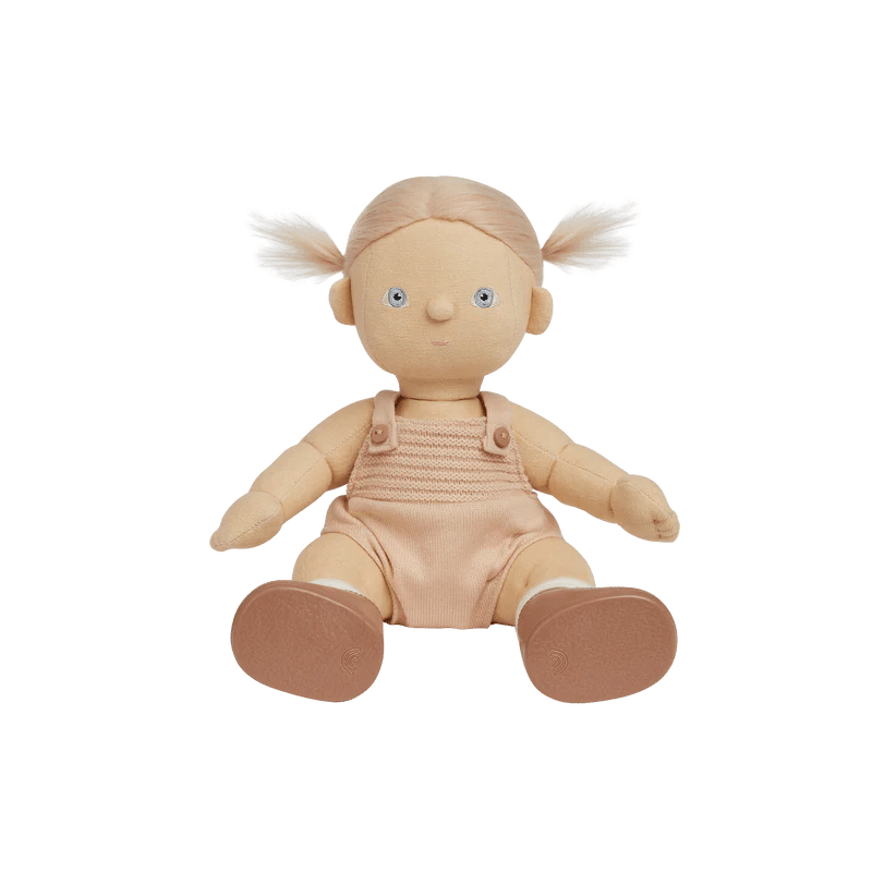 Plush doll with blonde hair in pigtails wearing a beige romper on a white background