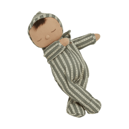Baby doll wrapped in a striped green and white blanket on a white background