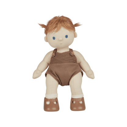Toy doll with red hair wearing a brown outfit on a transparent background