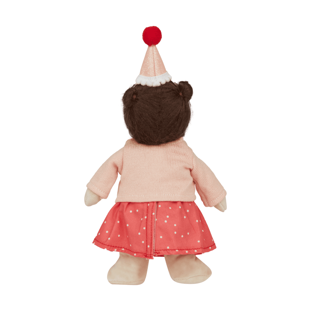 Stuffed toy with a pink sweater, red skirt, and party hat on a transparent background