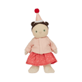 Stuffed doll with a pink outfit and red hat on a white background