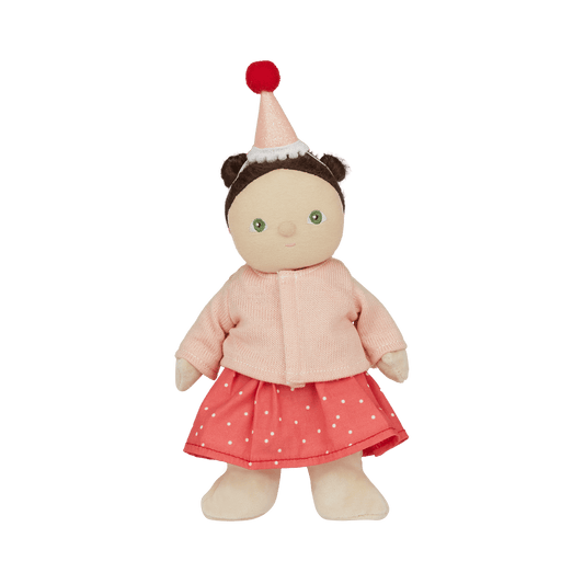 Stuffed doll with a pink outfit and red hat on a white background
