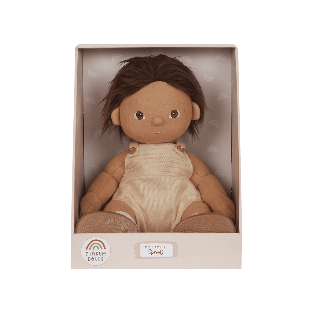 Doll in a beige box with a green background